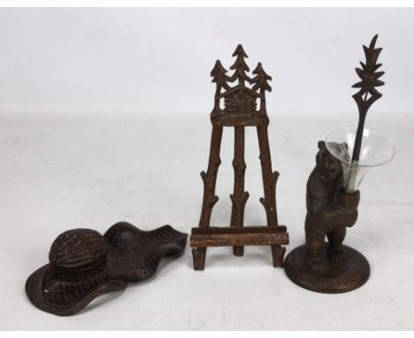 A group of early 20th century carved Black Forest items including a bear vase/pen holder bearing original label 'AD Urfer, Sc