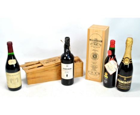 A bottle of Sandeman 1975 vintage port in Jaguar branded wooden case, also a cased Christopher Columbus Millennium celebratio