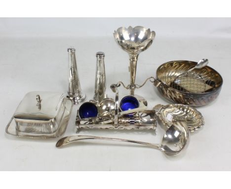 A small group of electroplated items to include a trumpet vase, a soup ladle, a butter dish and a pair of salt and pepper.