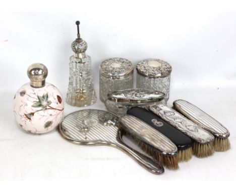 A collection of variously hallmarked silver topped dressing table pieces including a Victorian hand painted floral scent bott