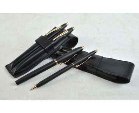 Three Cross pens comprising rollerball, biro and fountain and a propelling pencil in two Lamy leather cases (4).