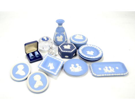 A group of Wedgwood blue jasperware dishes, trinket box etc and a boxed Swarovski paperweight.