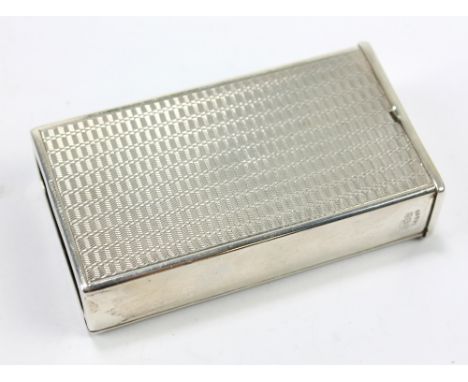 J R GAUNT &amp; SON; a George V hallmarked silver engine turned decorated match box cover with hinged side, Birmingham 1930, 