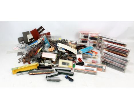 A collection of boxed Fleischmann N-gauge locomotives and carriages including Piccolo nos. 7160, 7232, 7094, 7171, etc, with 