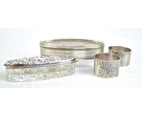 VINER'S LTD; a pair of George V hallmarked silver napkin rings with hammered finish, Sheffield 1932, a silver lidded hobnail 