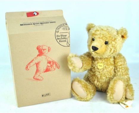 STEIFF; a boxed Button in Ear Classic teddy bear in golden mohair with glass eyes, stitched features, jointed limbs, cloth pa