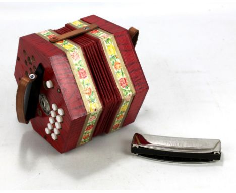 A Hohner 'Band' harmonica and a Scholer concertina no. 250/5, both boxed (2).