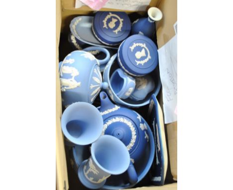 A collection of predominantly Wedgwood pale blue jasperware including teapot, pair of vases, bowl, etc, also some dark blue j