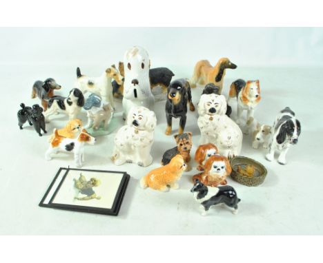 A group of ceramic dogs including Nao, Beswick, Sylvac, etc. CONDITION REPORT: Some items af.