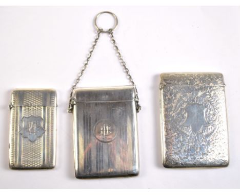 Three hallmarked silver card cases to include foliate scroll engraved example with vacant cartouche, John Rose, Birmingham 19