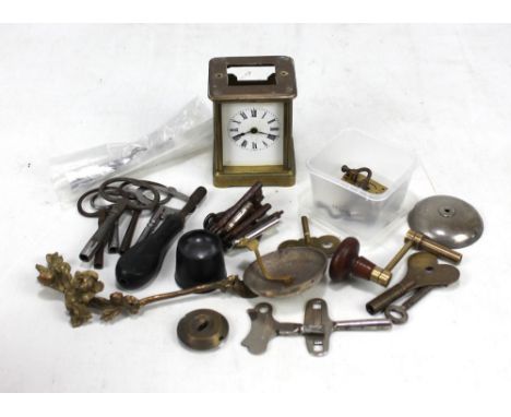 A carriage clock (for restoration), various keys, clock winding key, etc.