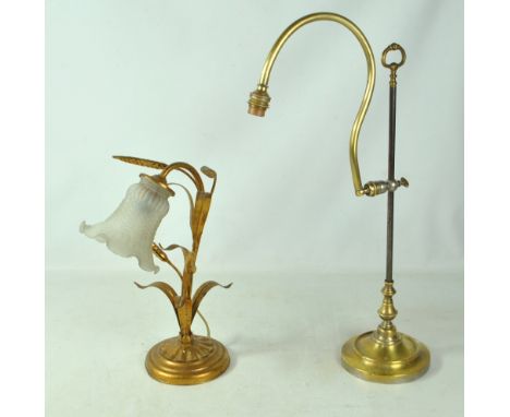 A weighted brass adjustable lamp with circular foot and a further decorative lamp (2).