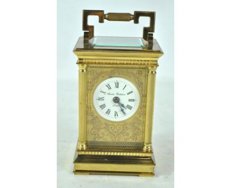 CHARLES FRODSHAM OF LONDON; a brass carriage clock, the white enamel dial set with Roman numerals, with floral and foliate en
