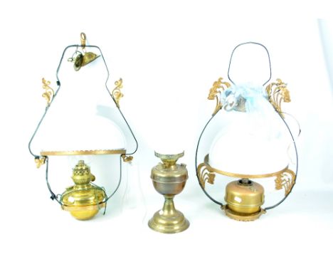 Two pendant oil lamps with opaque white glass shades, both converted to electricity and a brass table oil lamp (3).