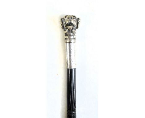 A Victorian carved ebony shafted walking stick with white metal mounts and initialled cartouche, the plated brass handle mode