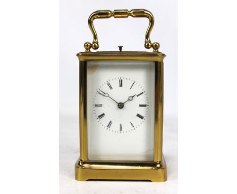 A circa 1900 brass repeating carriage clock, the white enamel dial set with Roman numerals and back plate no.2755, height 12.