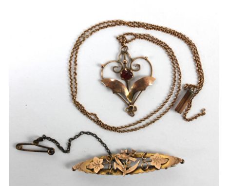 A 9ct yellow gold heart shaped open frame pendant set with ruby coloured glass, on 9ct gold chain (af), and a 9ct gold bar br