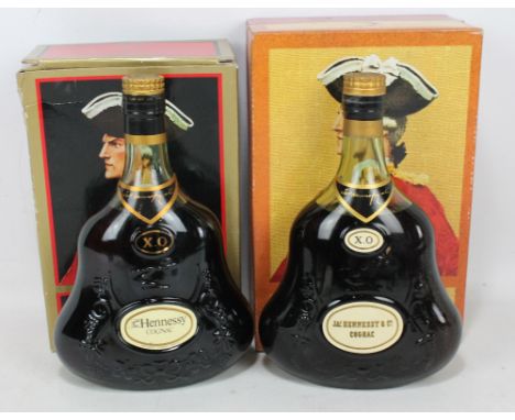 Two boxed bottles of Hennessy X.O Cognac., both 70 proof 24floz (2). CONDITION REPORT: Level to mid-shoulder.