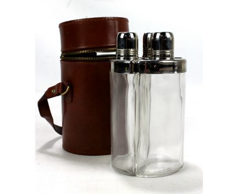 A leather cased three part spirit flask set.