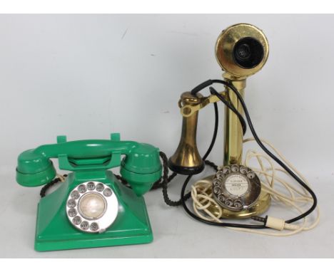 A 'Conversation Pieces' of Cheltenham candlestick telephone, 35cm, and a further green example (2). CONDITION REPORT: Oval un