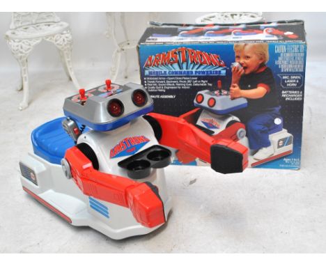 A boxed Tomy Armstrong Mobile Command Poweride ride on model robot. CONDITION REPORT: Box with wear and tear.