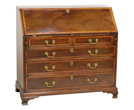 A George III mahogany and crossbanded bureau, the fall-front with well fitted interior above two short and three long graduat