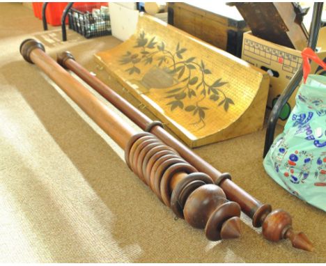 Two mahogany curtain poles, and a quantity of rings, and an unusual curved painted coat rack. CONDITION REPORT: Poles measuri