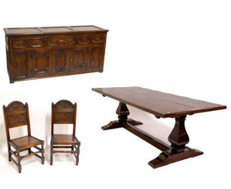 A reproduction oak dining room suite, the plank top table with cleated ends and substantial end supports to swept stretchers,