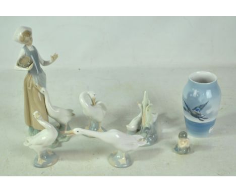 Four Lladro figures comprising a girl with goose and three further geese, a Nao example, a Royal Copenhagen figure of a merma