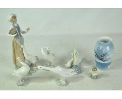 Four Lladro figures comprising a girl with goose and three further geese, a Nao example, a Royal Copenhagen figure of a merma