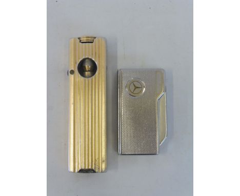 A 'Motorist Pipe Lighter', made in England plus a Mercedes Benz Colibri Executive lighter.