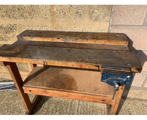 A small home-made bench with vice attached.