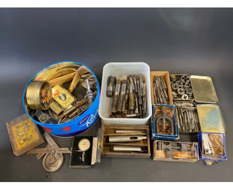 A collection of taps and dies plus assorted precision engineering tools. 