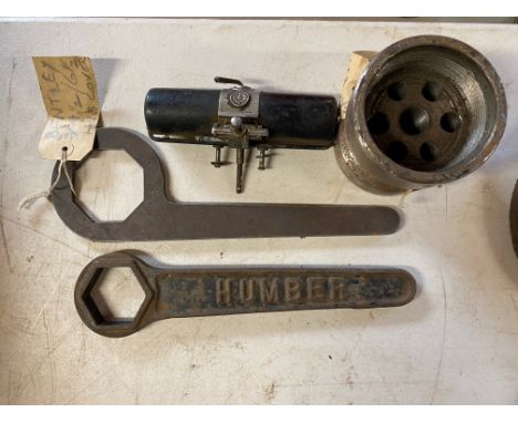 A Humber hub nut spanner, a Bentley 3 or 4 1/2 litre spanner, rear hub puller and a vacuum wiper motor.