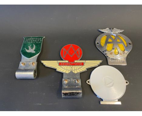 Four assorted car badges including Aston Martin Owners Club and Cambridge University Automobile Club. 