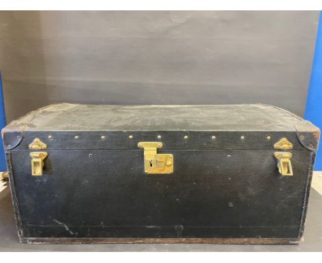 A Brooks trunk, with a shallow domed rising lid, and lift up inner lid, 32" w x 14" h x 18" d.