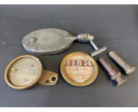 A Raydyot oval rear view mirror on bracket, two brass license holders and two tyre valve covers. 