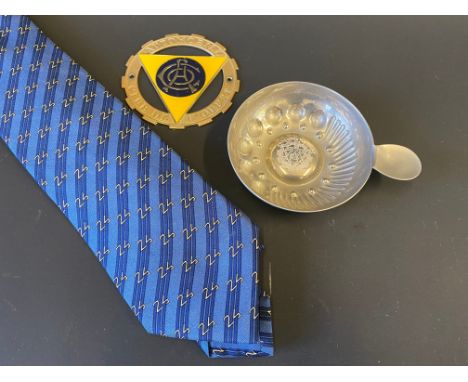 An Automobile Club de l'Ouest members silk tie, a car badge and a pewter ashtray. 