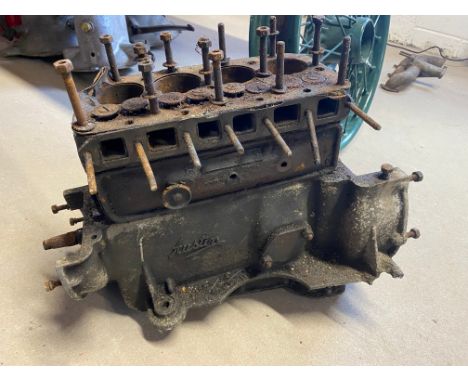 An Austin 7 engine, lacking internals. 