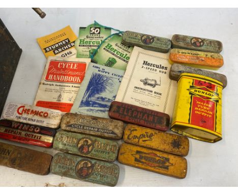 A collection of cycle puncture repair kit tins, various cycling ephemera and advertising, tools etc.