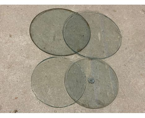 Four headlamp lenses, one textured, one with original Lucas transfer. 