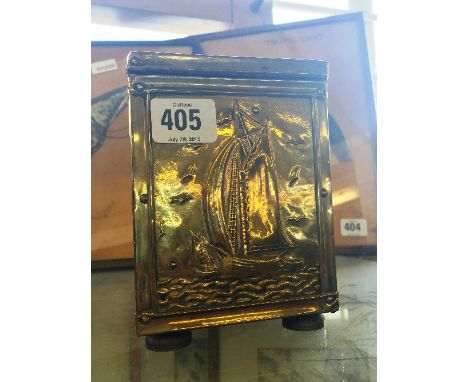 An Arts & Crafts brass square shaped tea caddy with Sailing Ship design to front panel.