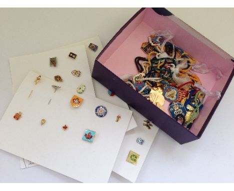 A box containing various late 20th century Race Course enamel badges together with four cards of modern collector's badges.