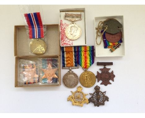 A Father & Son group of WWI and WWII medals awarded to Private R. J. Gwynne of the Army Cycling Corp 10818 together with two 