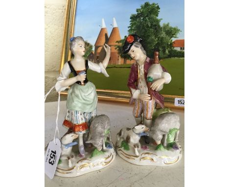 A pair of Dresden porcelain figures modelled as a Scottish Shepherd and Shepherdess.