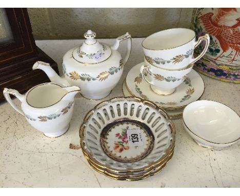 A Coalport bone china Tea-For-Two set decorated in a stylised leaf pattern in gold and grey on white ground together with thr