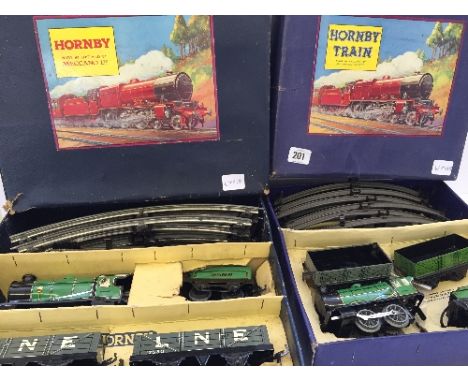 A Hornby M1 Goods train set in original box made by Meccano with engine, tender and two open trucks with rail circuit (box to