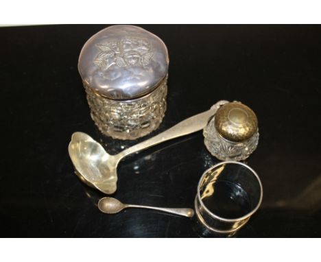 TWO SILVER TOPPED VANITY JARS TOGETHER WITH A HALLMARKED SILVER NAPKIN RING, SPOONS ETC.