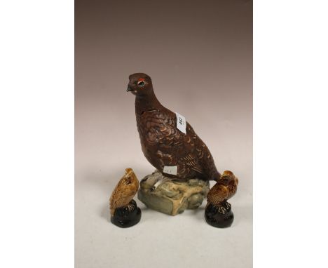 A ROYAL DOULTON FAMOUS GROUSE DECANTER TOGETHER WITH TWO SMALLER BESWICK EXAMPLES 