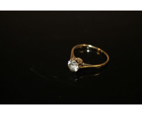 A 9 CARAT GOLD SOLITAIRE DRESS RING SET WITH A CLEAR STONE